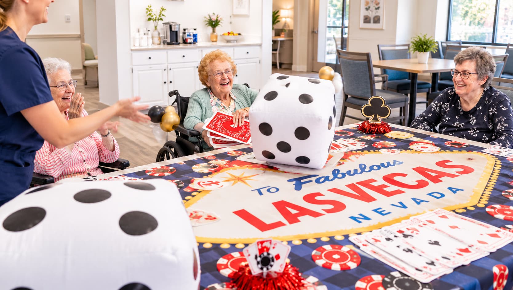 Residents and staff gathered around a Las Vegas themed game table at Lakeland